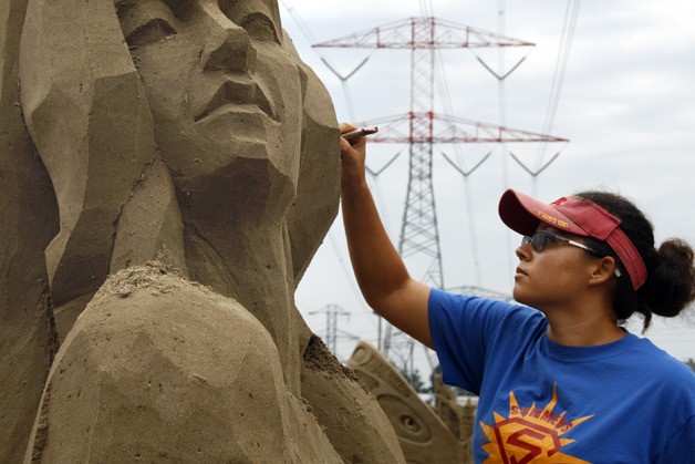 Sue McGrew of Tacoma works on her sculpture at the Northwest Sand Festival. She won third place in the solo division.