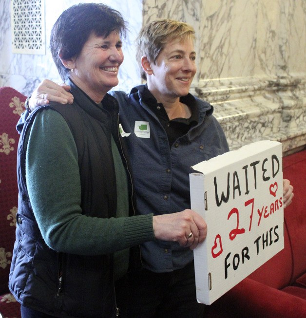 A couple celebrates Washington's same-sex marriage bill on Feb. 13 after Gov. Chris Gregoire signed it into law.
