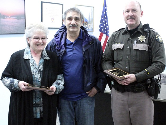 Jo Ann and Dan deLeon are pictured with King County Sheriff Deputy David Lyon at an awards ceremony Tuesday at South King Fire and Rescue’s station on South 312th Street. Jo Ann saved her husband’s life last summer when he suffered a heart attack.