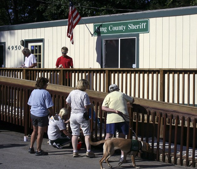 Members of the PAWS (People Helping Animals) team spruced up the King County Sheriff’s Office substation on Aug. 16 in the Lake Dolloff neighborhood.
