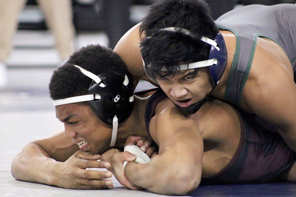 Adrian Avena gains control over Bethel's Dante Springsteen after a takedown during the 152-pound championship match.