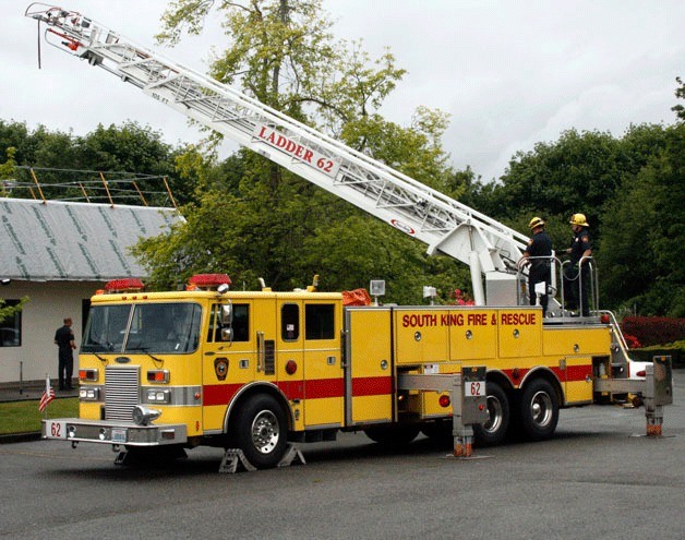 South King Fire and Rescue firefighters in 2012 test the oldest ladder truck (1981) in the fleet at Station 62 on South 312th Street.