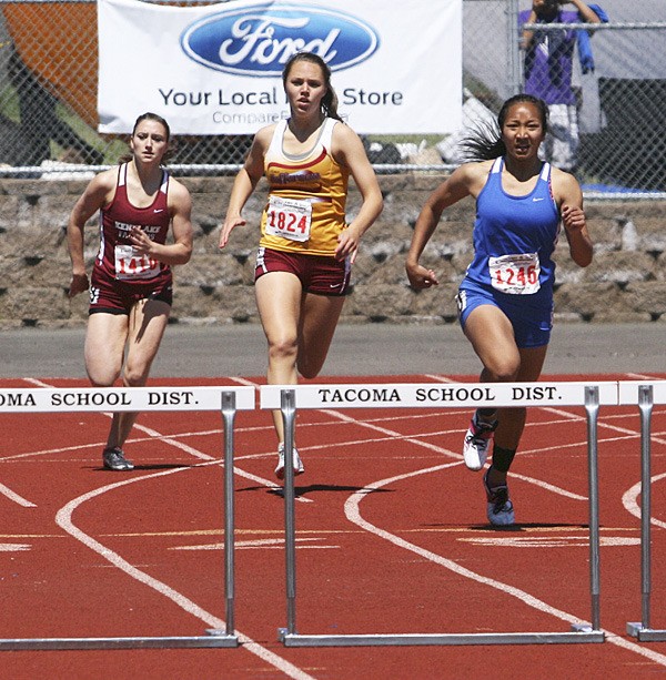 Federal Way freshman Mariyah Vongsaveng (right) won the Class 4A state title in the 300-meter hurdles during last weekend's state track and field championships at Tacoma's Mount Tahoma High School. Vongsaveng leads TJ senior Lindsey Dahl (center).
