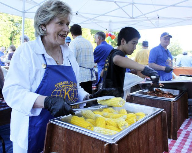 The 2013 Federal Way Kiwanis Salmon Bake is slated for July 26 at Steel Lake Park. Pictured: Former city councilmember and current State Rep. Linda Kochmar doles out corn on the cob.