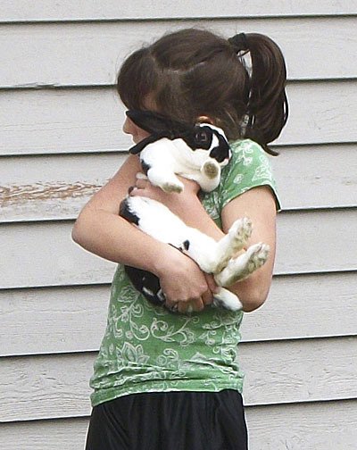 A pet bunny in the arms of Jan Hallahan's daughter.
