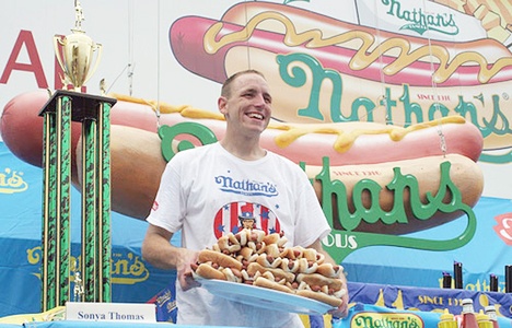 Joey Chestnut set a new record by eating an amazing 68 hot dogs in 10 minutes at the Nathan’s Hot Dog Eating Contest July 4.