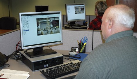 Police volunteer Dave Gantt and volunteer Lottie Kinney keep a watchful eye on Federal Way through Safe City cameras.