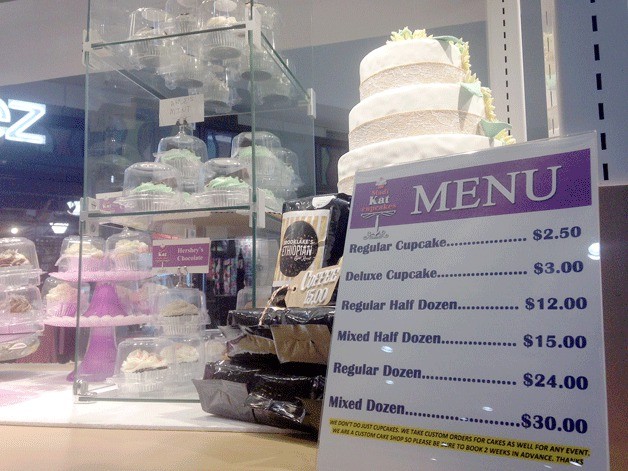 A menu of MadiKat Cupcakes delicious offerings. The business is located at a kiosk in The Commons mall near Starbucks.