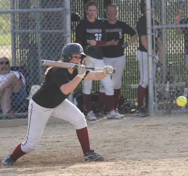 Jefferson senior Katie Jackson puts down a bunt during the Raiders' 2-1 extra-inning win over Kentwood Monday. Jackson finished 2 for 4 at the plate and picked up the win on the mound for TJ.