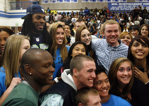 Seattle Seahawks cornerback Richard Sherman poses with students Oct. 2 at Federal Way High School.