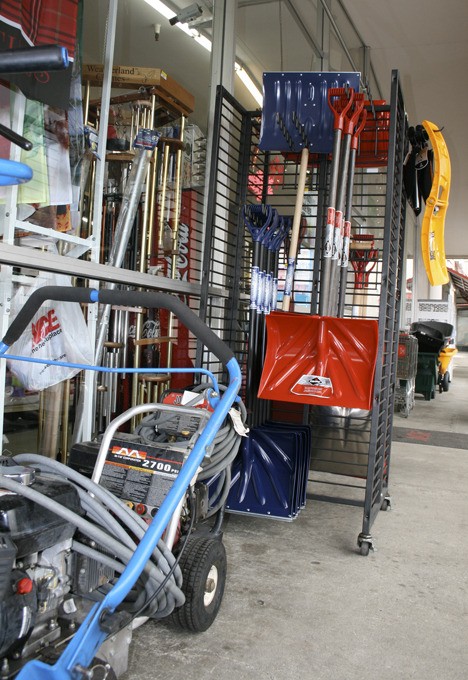 Walker Ace Hardware  is stocked up on snow equipment. Popular items are displayed on the sidewalk.