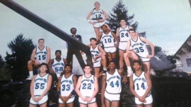 Here is a photo that appeared on the popular deadspin.com website Thursday of the 1987-88 Federal Way High School boys basketball team taken at Fort Lewis. Then-senior Sean Sehlin is seen holding an uzi machine gun on top of a tank.
