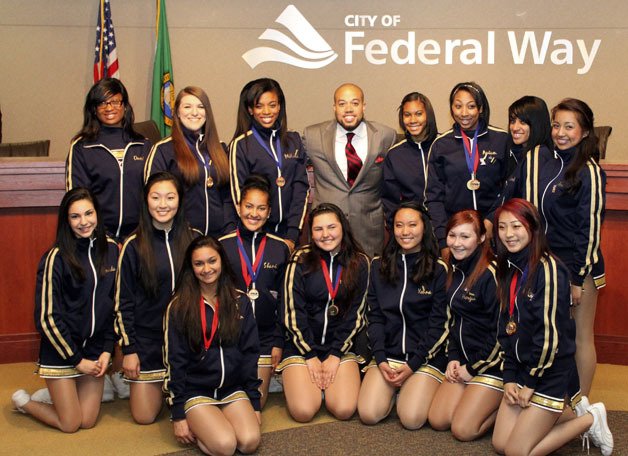Justin Henderson poses with the Decatur High School Dance Team on June 5 at City Hall.