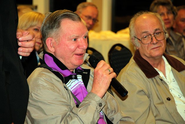 A resident asks a question during the Mirror's candidate debate on Wednesday at the Twin Lakes Golf and Country Club.