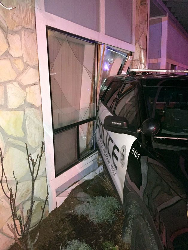 An unoccupied Federal Way police vehicle crashed into a home on Monday evening.