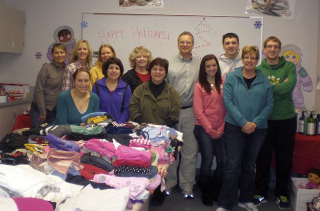 Pictured is the Enterprise “Elf Crew” who met Dec. 15 to organize the gifts and donations for the families to pick up.