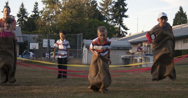 Participants in the sack races held during a family-friendly evening Sept. 3 at Grace Church on Dash Point. About 300 parents and students attended.