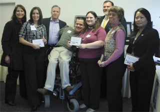 From left: Terri Kester of Tacoma Weekly; Tia Hunsperger of Impressions Group; Brent Meisner of Doyon Government Group; Kevin and Melinda Berg of CompuPane; Victoria Siverson of YourTravelBiz.com; Nicole Ngonevolalath of Key Bank.; In back is Dan Altmayer; chair of the Federal Way Chamber.
