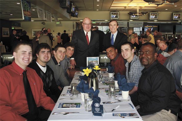 King County Councilman Pete von Reichbauer and Mariners General Manager Jack Zduriencik are shown with the Thomas Jefferson High School baseball team during the breakfast..