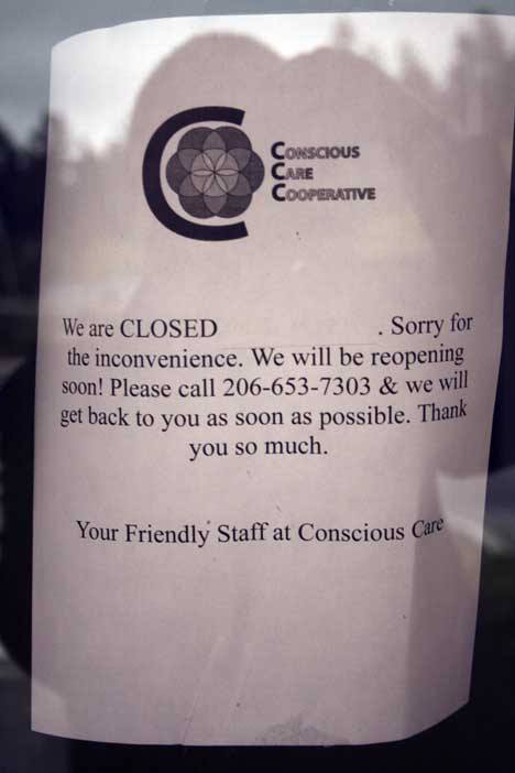 A sign on the door of Conscious Care Cooperative