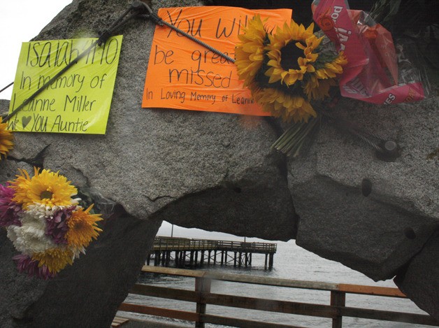 Well-wishers have left flowers and signs at the Redondo pier in honor of Leanne Miller