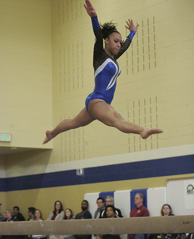 Tia Thomas from Federal Way High competes on the beam Saturday at the 4A district gymnastic meet.