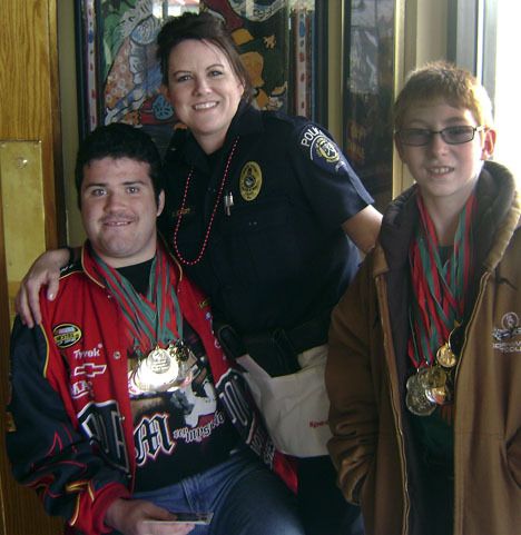 Federal Way police officer Stacy Eckert and Special Olympics Washington athletes Cory Dempsey
