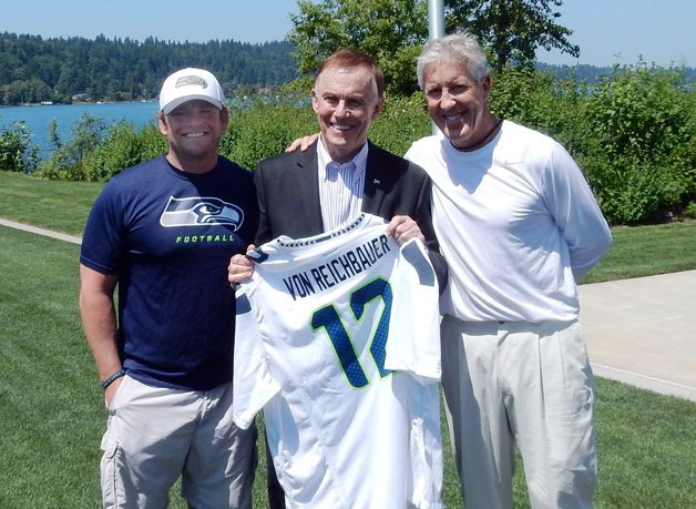 King County Councilmember Pete von Reichbauer with Seattle Seahawks General Manager John Schneider and Coach Pete Carroll after being recognized as the original “12th man.' Municipal League will honor the councilman with the Public Official of the Year Award on April 2.