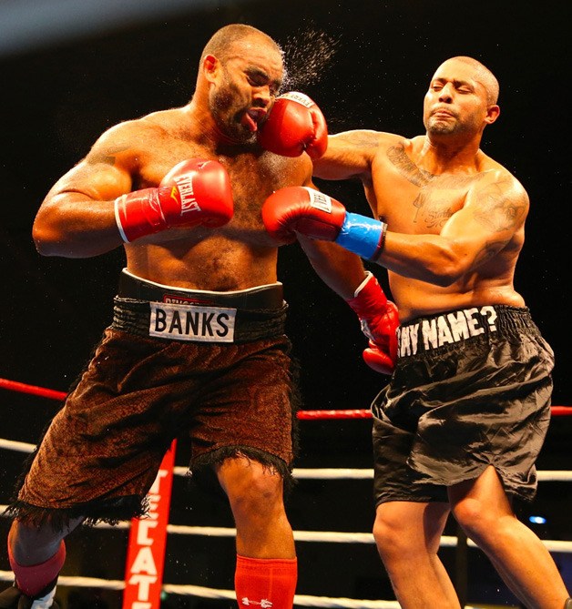Federal Way heavyweight boxer Vincent Thompson delivers a blow to Yohan Banks.