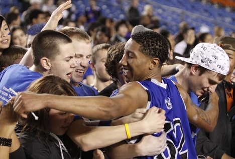 Federal Way High School guard Jeffrey Forbes hugs the Eagle crowd after winning the 2009 Class 4A state basketball championship inside the Tacoma Dome.
