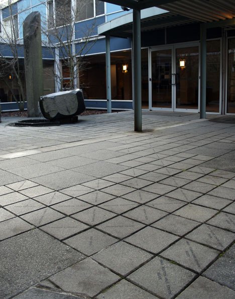 The entrance at Dumas Bay Centre features dozens of pavers inscribed with people’s names.