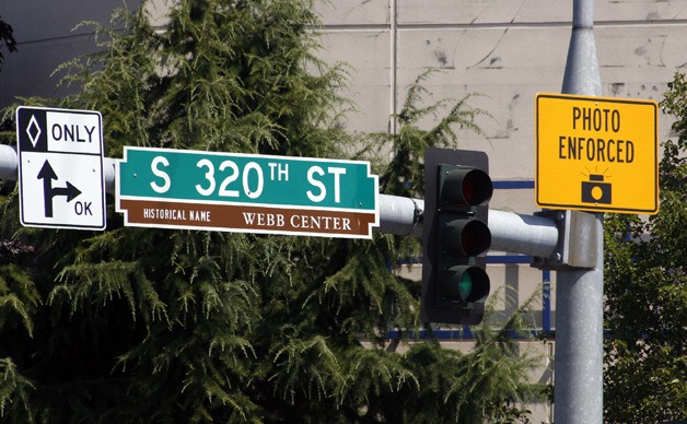 The intersection of South 320th Street and Pacific Highway South features photo enforcement cameras for red light violations.