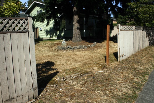 A fence was knocked down during a raid Aug. 23 on a rented house at 32919 3rd Avenue SW. The fence faces SW 330th Street.