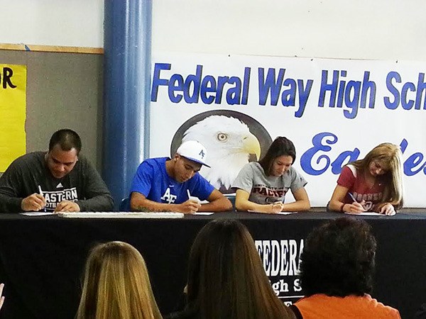 On Wednesday four student-athletes from Federal Way HIgh School signed their national letters of intent. From right to left