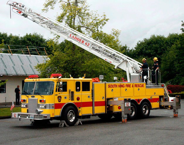 South King Fire and Rescue firefighters uses one of the oldest ladder trucks in its fleet in 2012. Fire district officials hope to replace aging vehicles and equipment.