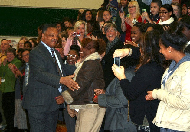 Technology Access Foundation Academy students greet Rev. Jesse Jackson during an event on Monday focusing on gender inequality.