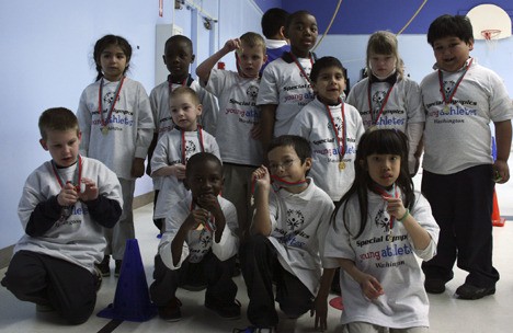 The Special Olympics day at Mirror Lake Elementary School gave typically developing and special education students a chance to participate together in sports. Here several students from both groups show off their medals they received for participating.