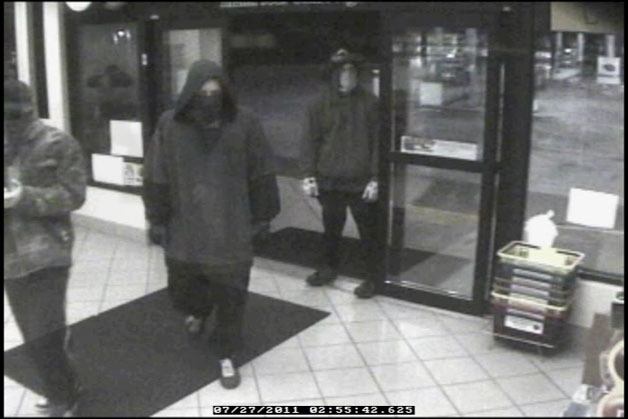 Surveillance footage of three armed robbery suspects