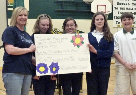 Pictured: Builders Club members presented a “check” to Stacie Martin