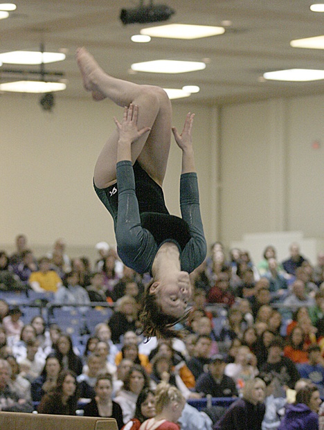 Todd Beamer High School senior Kaylyn Borden flips off the balance beam during Saturday's state meet.