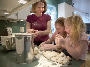 Mary Ellard-Ivey and her daughters Fionnuala and Molly make Irish soda bread.