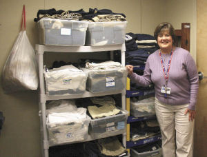 Parent- student advocate Colleen Seydell shops for school uniforms for the students at Mark Twain Elementary once a month