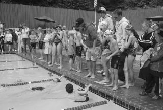 Swimmers gather in and around the pool at Marine Hills last week during a meet against Twin Lakes. Marine Hills won the yearly summer meet