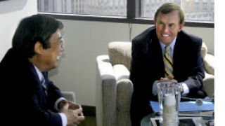 Republic of Korea Consul General Haryong Lee speaks with King County Council member Pete von Reichbauer on July 21.