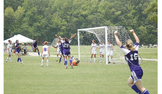 The Federal Way United Reign ‘93 Purple team celebrates the winning goal in the championship game of the United States National Cup finals in Virginia Beach