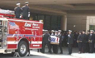 A memorial for East Pierce Fire and Rescue Chief Dan Packer was held Aug. 7 at the Christian Faith Center in Federal Way as part of a procession that spanned Pierce County. Packer