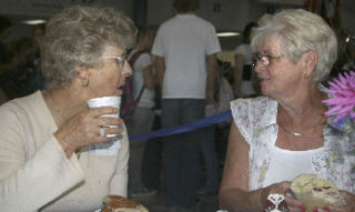 Judy Hoffman and Gladya Fenstermacher share lunch together during the class of 1958 50th reunion at Federal Way High School last week.