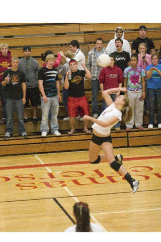 Thomas Jefferson High School senior Rachelle Eckert goes up for a spike in front of the Raider crowd Wednesday night during a match against Kent-Meridian. The Raiders were swept in three games.