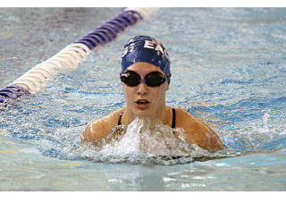 Federal Way High School’s Dalynn Wingard swims the breaststroke leg of the 200-yard individual medley during a SPSL North Division meet with the Kentridge Chargers Thursday at the Federal Way Community Center. For complete high school results