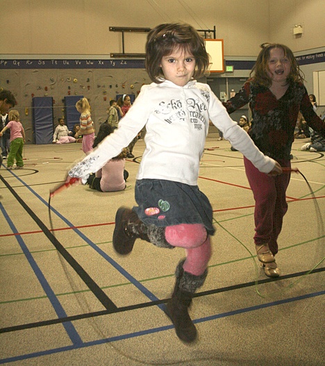First-grader Erica Kudrik jump-ropes on one foot during a class at Enterprise Elementary last week.
